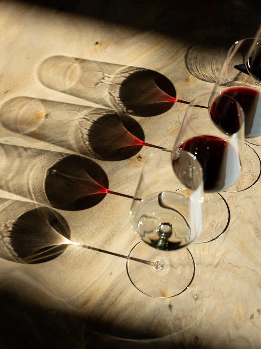 A group of wine glasses on a table.